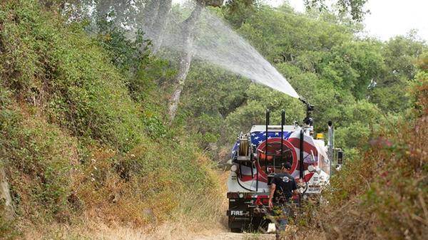 Truck spraying the hedges