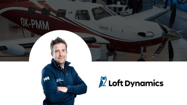 Jean Auclair alongside Loft Dynamics logo and aircraft