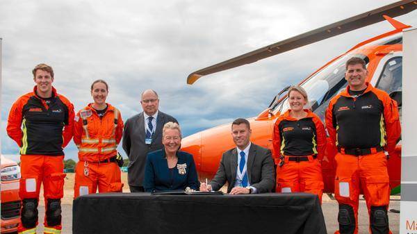 Magpas Air Ambulance signs the Armed Forces Covenant, alongside armed forces personnel and LL Julie Spence OBE