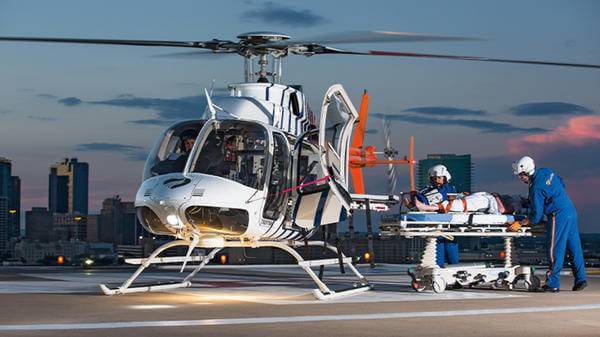 Helicopter with city skyline background