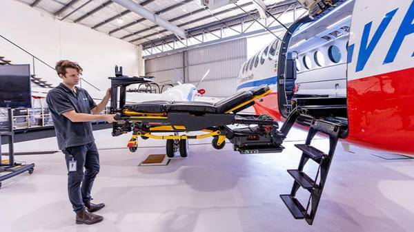 Apparatus being pushed into rescue aircraft