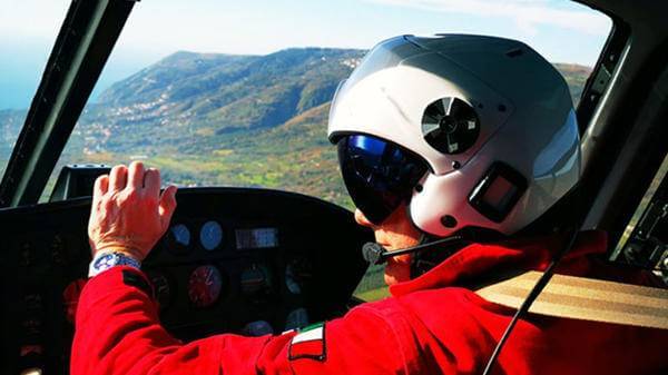 man flying helicopter