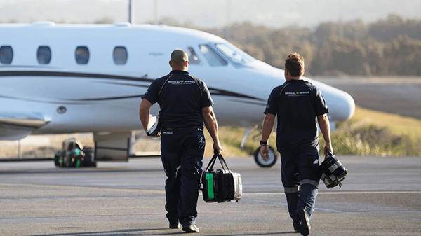 Back of Pilots walking towards plane