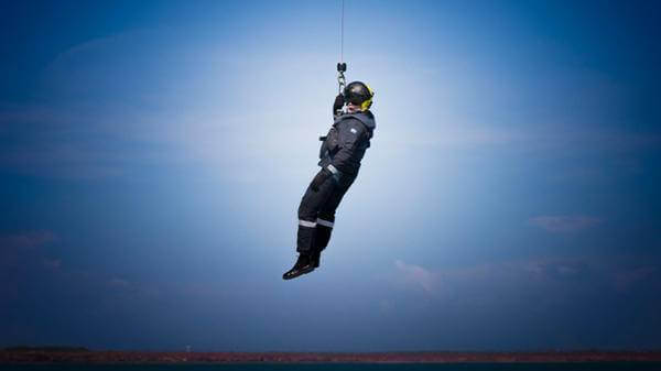 Helicopter paramedic on winch