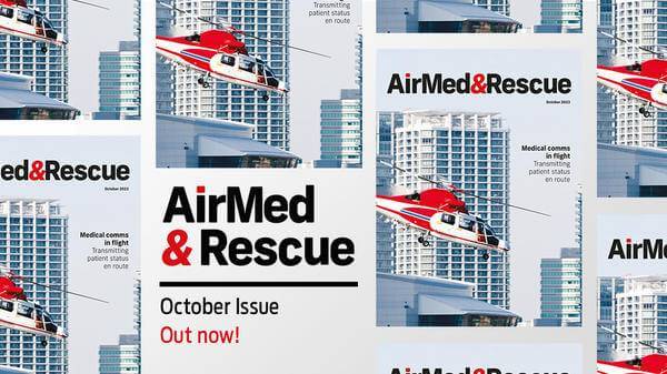 red helicopter in flight