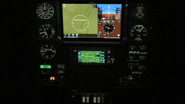 Inside of helicopter cockpit lit up