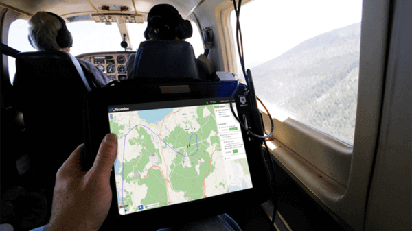 Map on tablet device sitting in helicopter