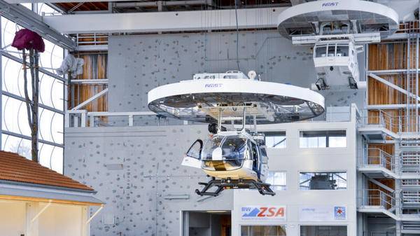 Rescue hoist trainer being installed in a helicopter pilot training facility