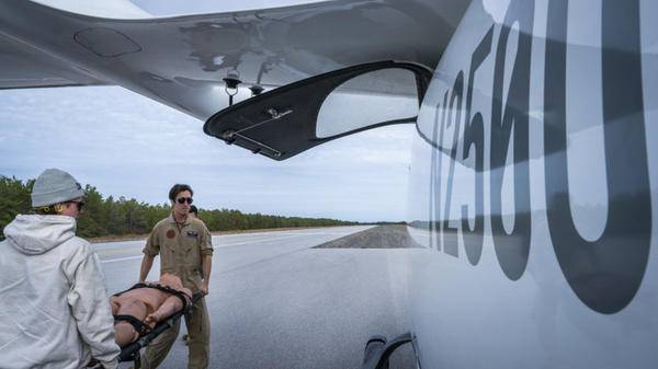 Image of test training with helicopter and stretcher