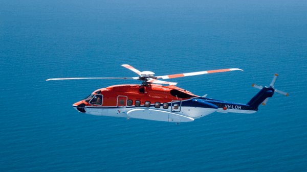 Image of helicopter over sea