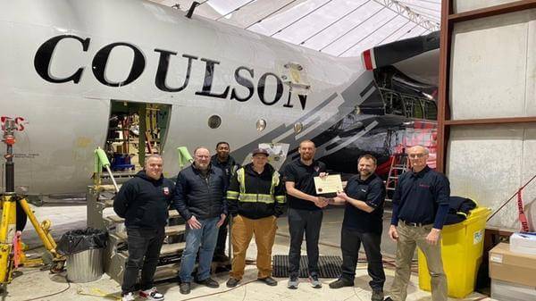 Image of Coulson Aviation team being awarded approval for pilot training