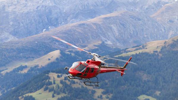 Image of air ambulance flying over countryside
