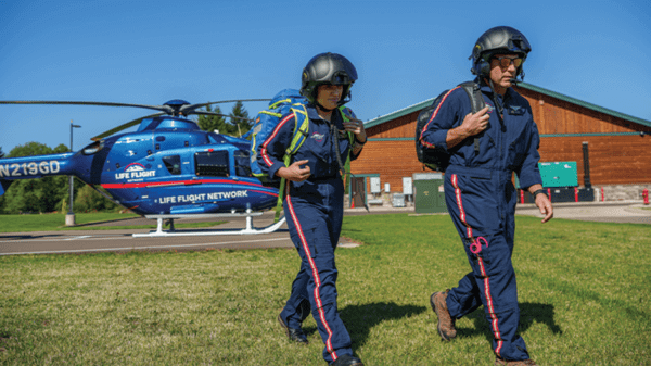 Pilots walking past helicopter
