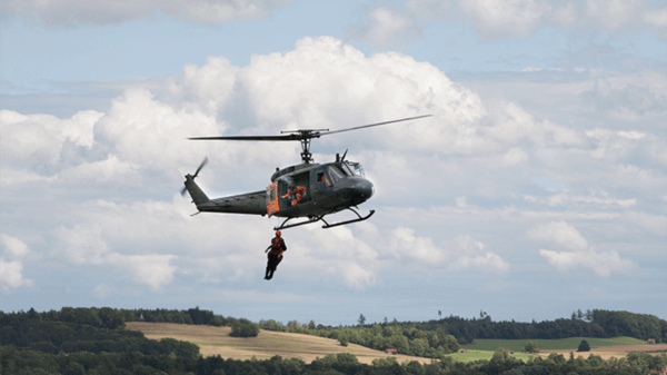 Helicopter flying above countryside