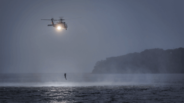 Helicopter flying above lake