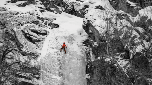 Man climbing mountain