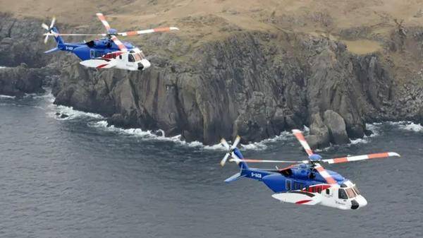 Image of Bristow helicopter flying over sea