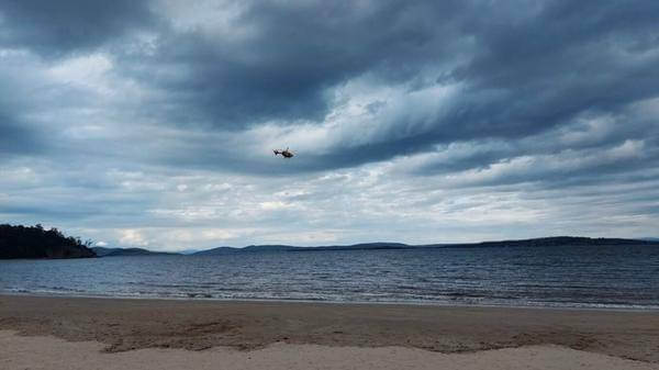 Image of helicopter over water