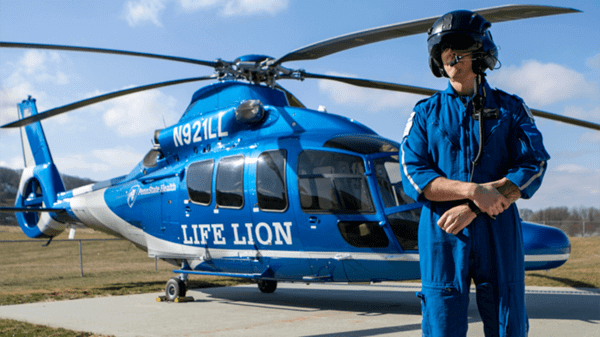 Baily next to helicopter