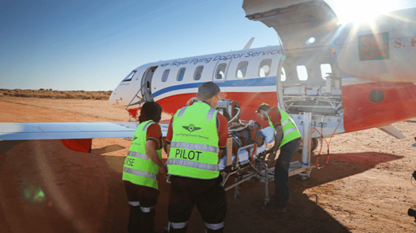 Patient getting put on medical plane