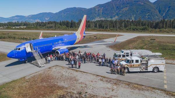 Coulson Aviation welcomes the newest addition to its aerial firefighting fleet, a Boeing 737-700, with a water cannon salute