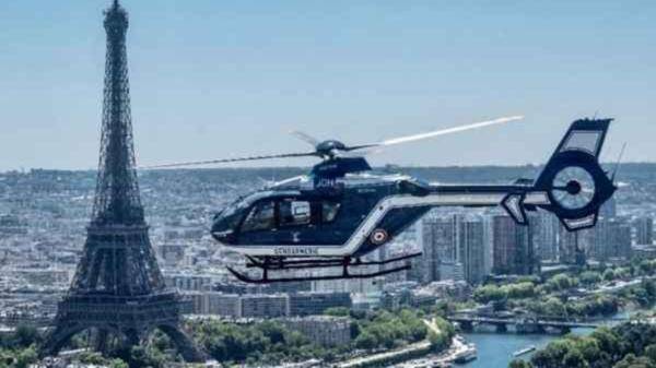 Image of Police helicopter flying over Paris