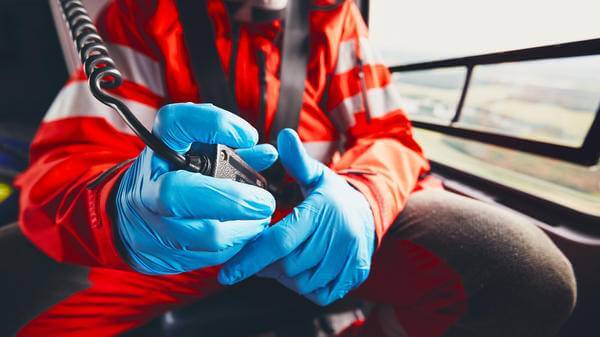 Medevac worker with walkie talkie in hand