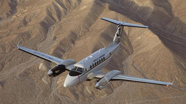 Plane flying over desert