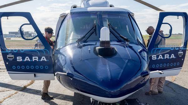 Static helicopter with doors open