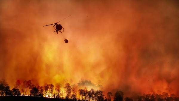 Image of aerial firefighting of wildfire in US