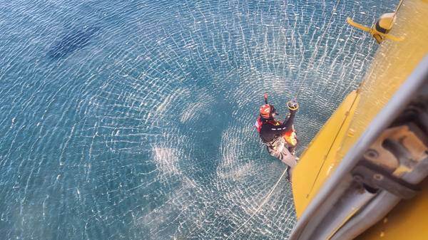 Rescuer about to dive in the water