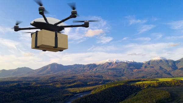 Drone delivery concept. Autonomous unmanned aerial vehicle used to transport packages.
