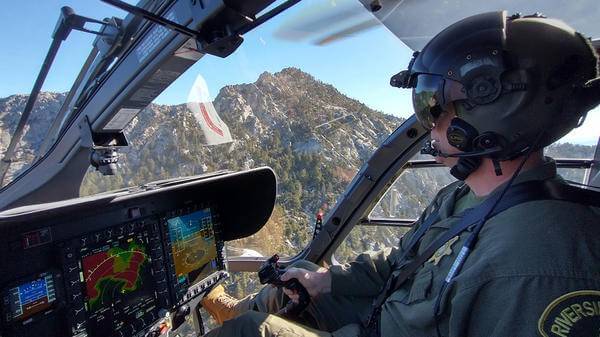 Mike Calhoun in helicopter cockpit
