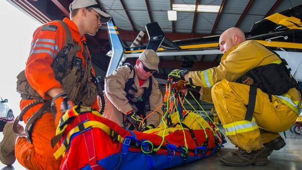 Training exercise of patient being treated by rescue workers