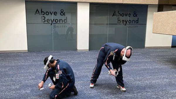 Two people training in room with simulators