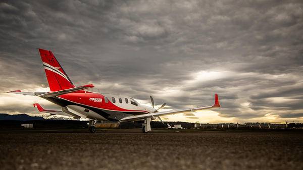 Conair plane parked on runway