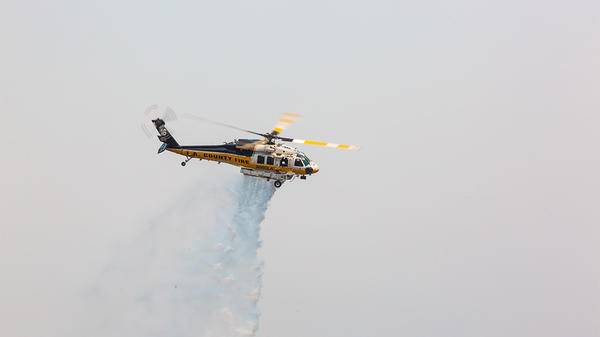 La County fire helicopter dropping fire retardant