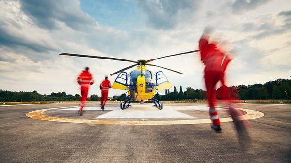 Paramedics rushing towards helicopter