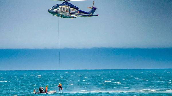 Air rescue helicopter saving stranded people