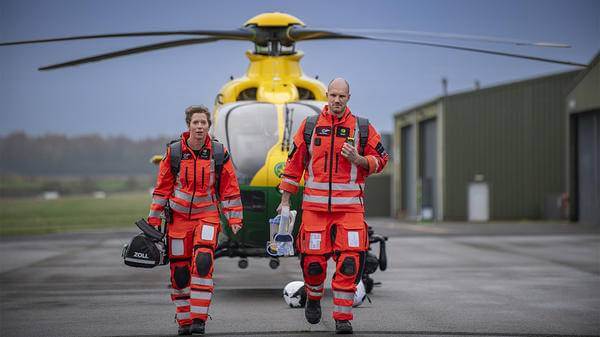 Paramedics walking from helicopter