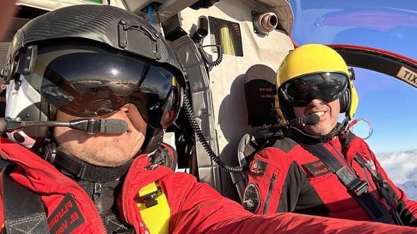 Two people in a small aircraft taking a selfie