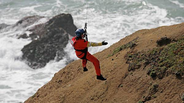 Rescue worker attached to hoist