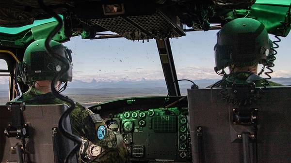 helicopter pilots in cockpit