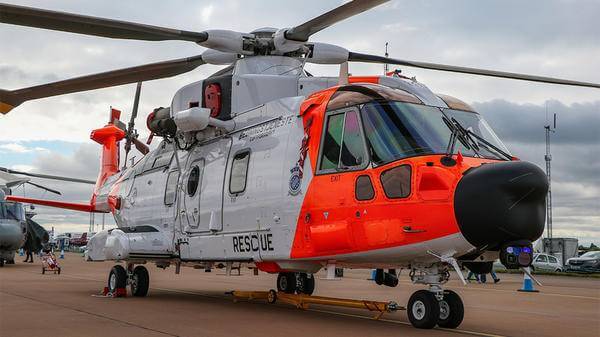 Parked orange rescue helicopter