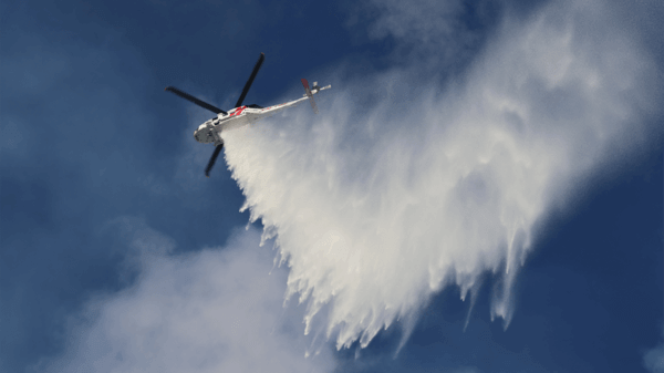 Helicopter dropping fire retardant