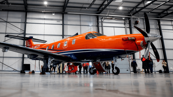 Orange Skycare fixed-wing plane