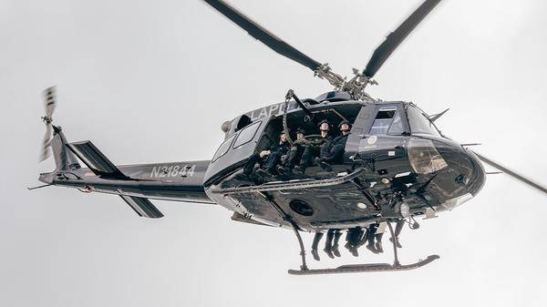 LAPD helicopter with police sitting on side