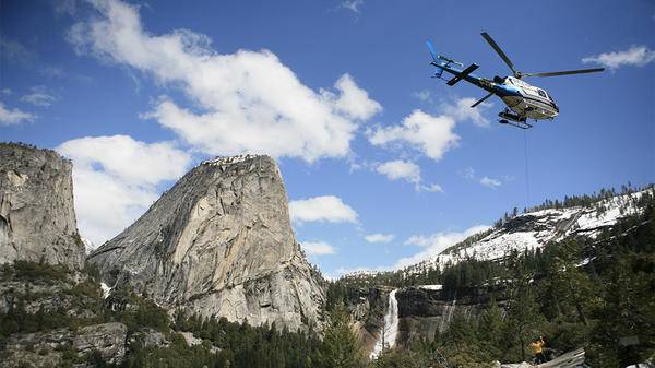 Helicopter flying over mountains