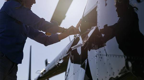 Person working on helicopter