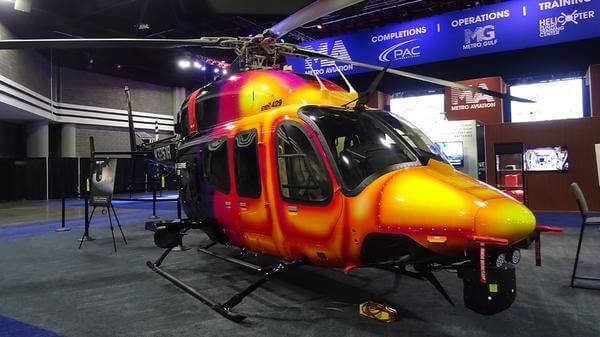 Yellow and red parked helicopter